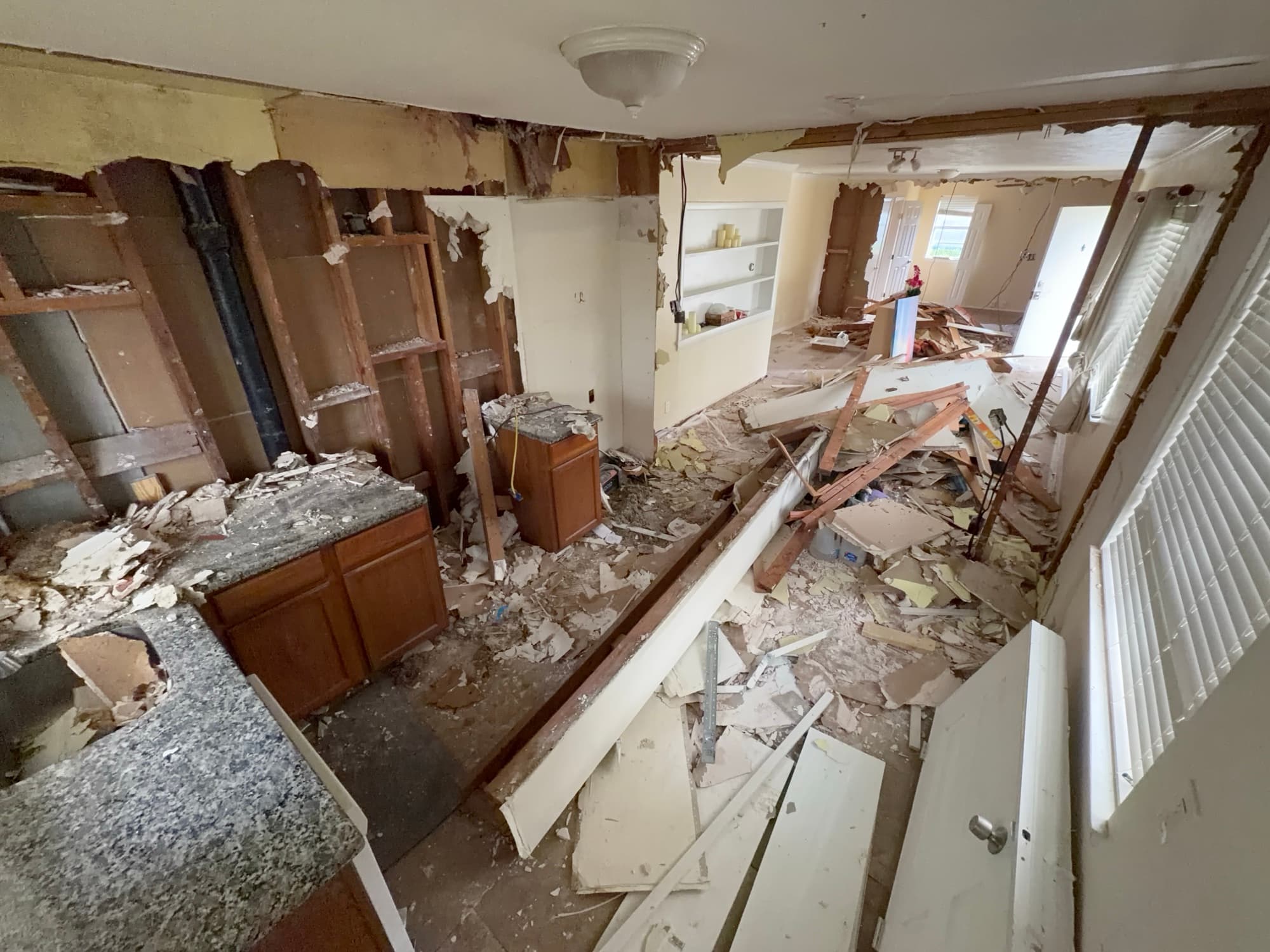 Kitchen mid-demolition, taken down to the studs