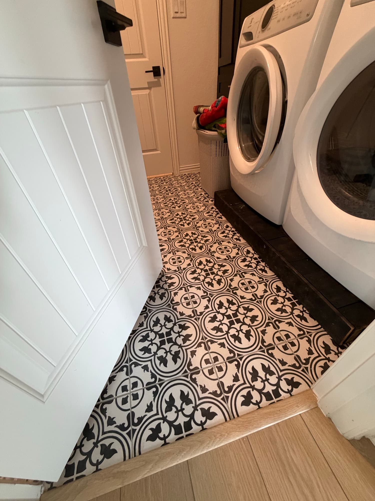 Laundry room with patterned cement floor tile