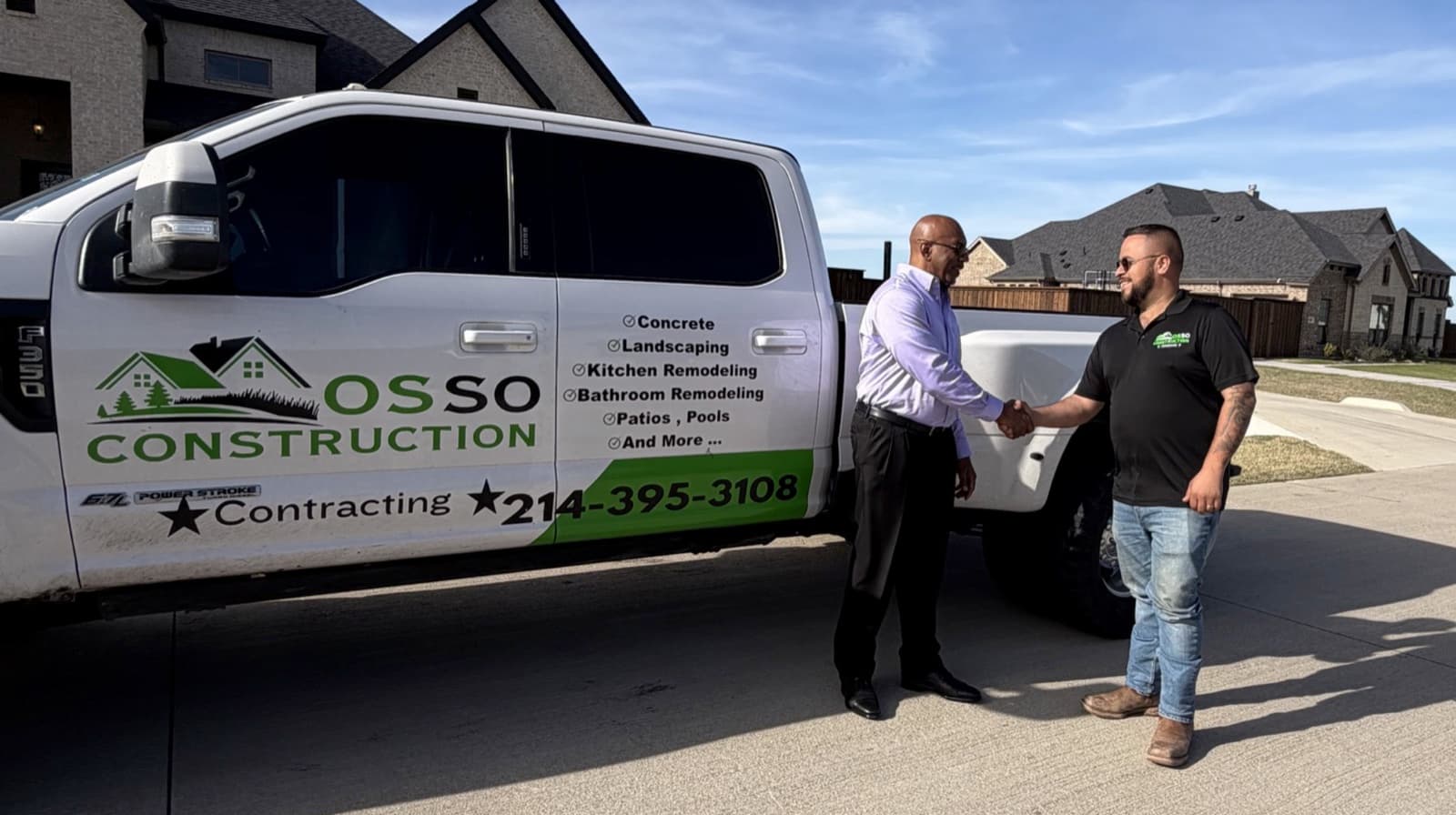 Osso Construction owner shaking hands with a homeowner next to the company truck